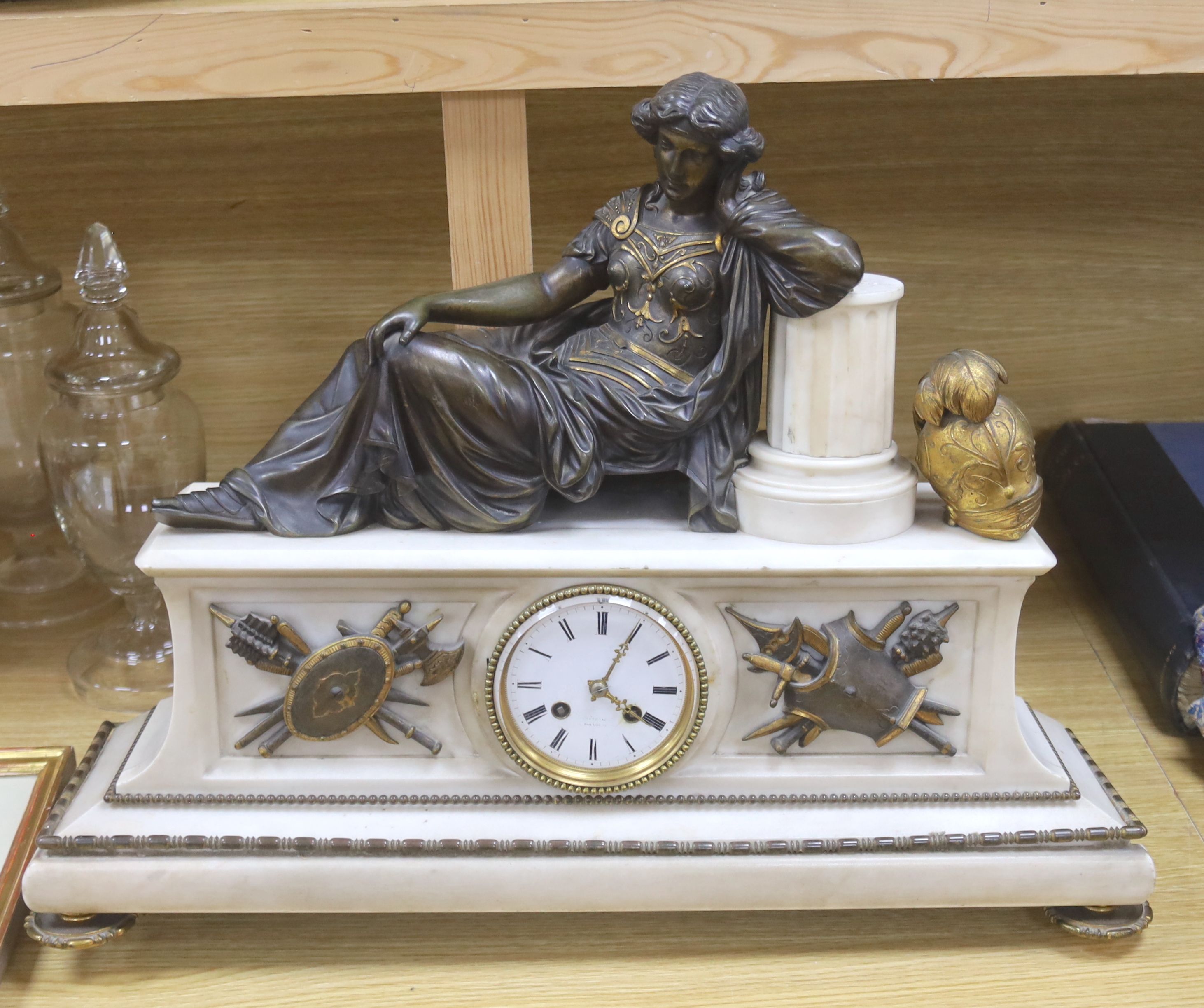 A 19th century gilt metal and marble figural mantel clock, length 58cm